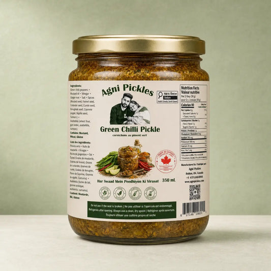 A 350 mL glass jar of Agni Pickles Green Chilli Pickle with a gold metal lid, shown against a neutral light green background.