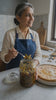Homemade green chilli achar with rustic Indian branding and mom serving dinner, lunch